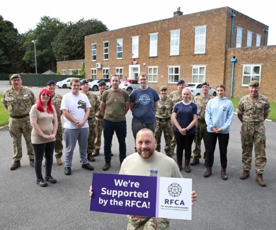 Professional support staff member with potential adult volunteer