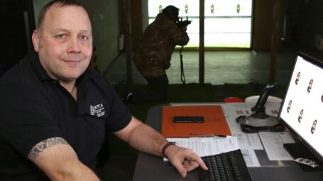 RFCA permanent staff member Andy Marshall demonstrating the new computer-based shooting system for cadets