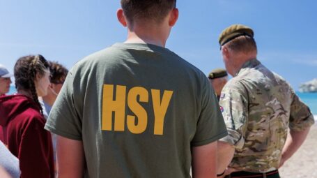 Cadet in tee shirt on sunny beach