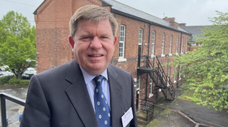 Man in a suit smiling