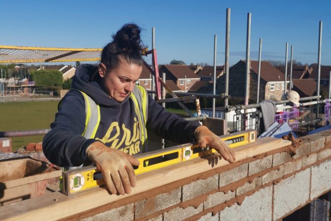 Woman bricklaying