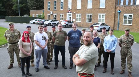 Cadet volunteer with civilians in the background
