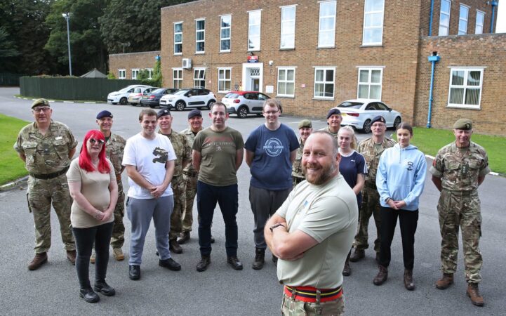 Cadet volunteer with civilians in the background