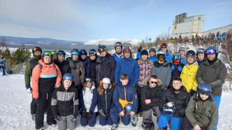 Group of teens in ski clothing in the mountains